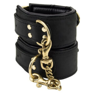 Black nubuck leather slim wrist cuffs with gold metal hardware and connecting clips