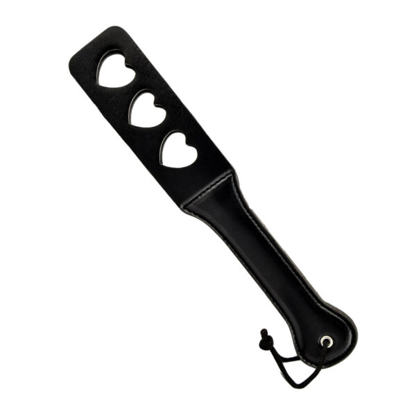Black paddle with three heart-shaped cutouts and wrist strap